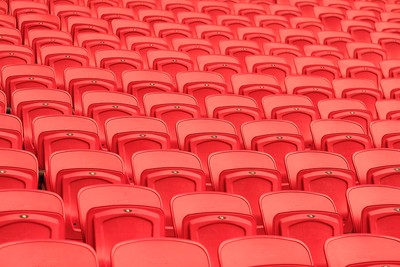 Rows of Empty Red Folding Stadium Seats