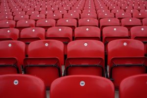 Rows of Empty Red Numbered Stadium Seats