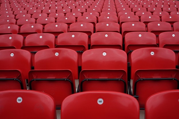 Rows of Empty Red Numbered Stadium Seats
