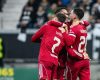 Andy Robertson hugging teammates