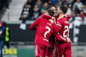 Andy Robertson hugging teammates