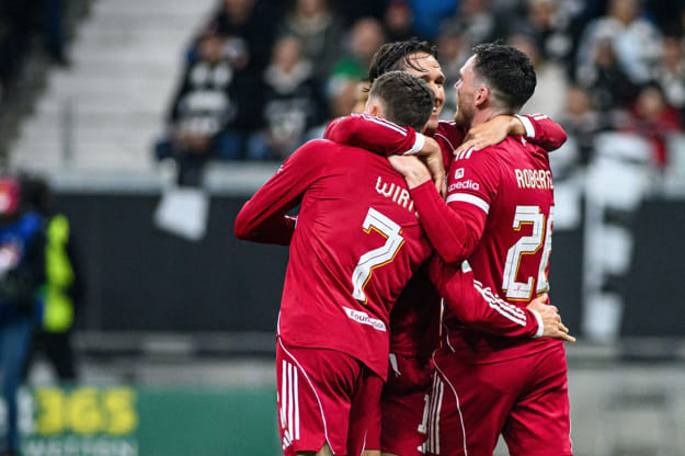 Andy Robertson hugging teammates