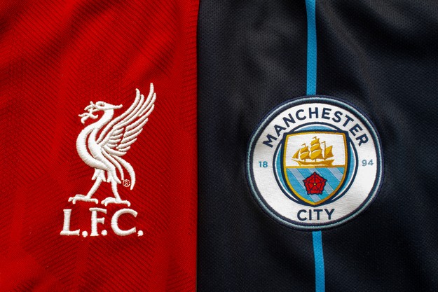 Liverpool and Manchester City Shirt Logos